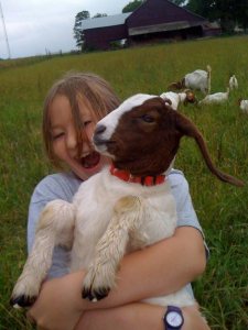 child with a goat