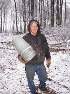 Jerry with an arm full of buckets for maple sap