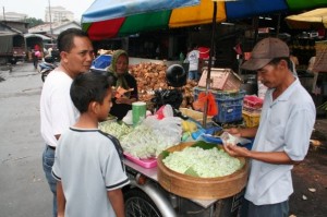 Samshul and Afiq picking out holiday foods -- lots of rice!