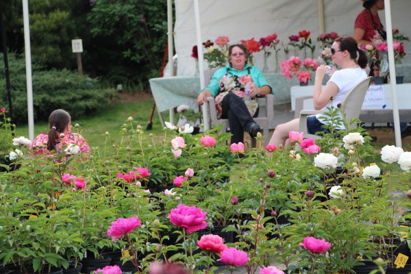flower farmer Therese resting with friends after a long day